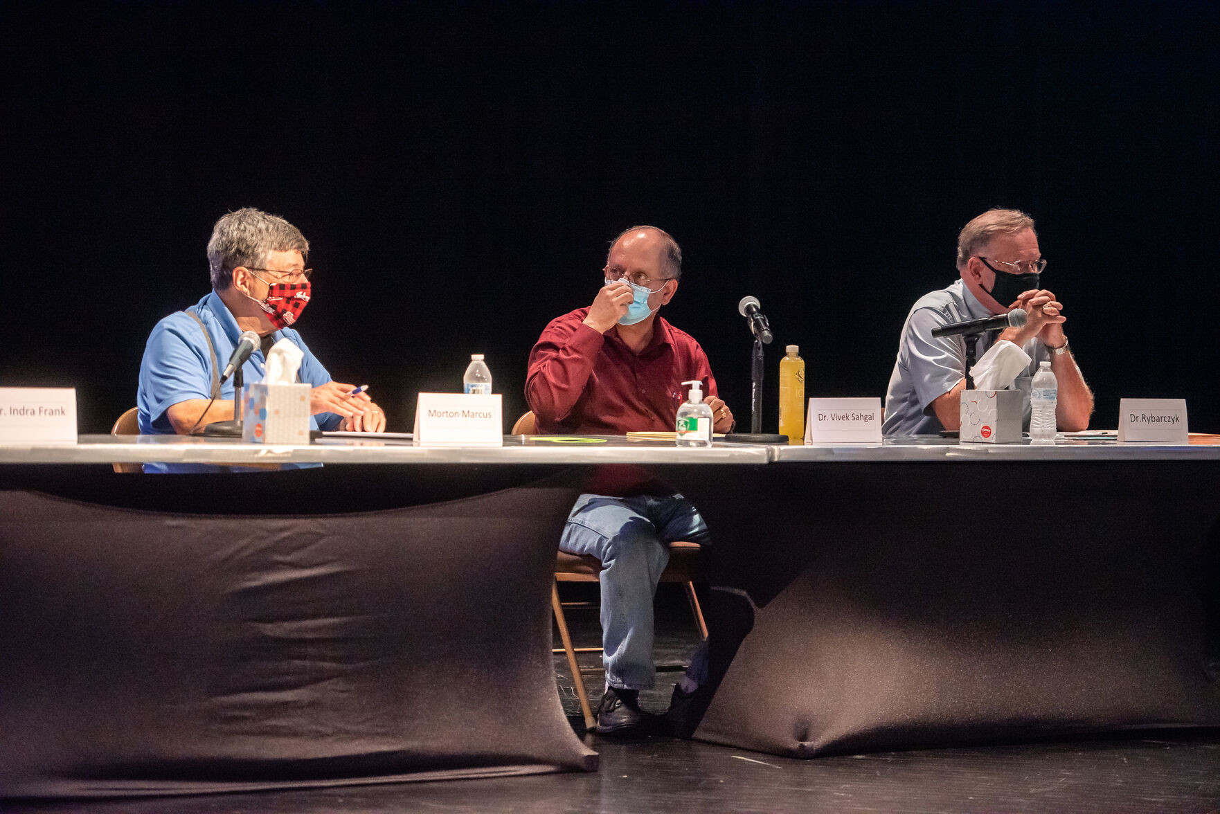 Zinc plant sides square off in public forum